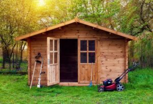 storage space with mower and yard tools