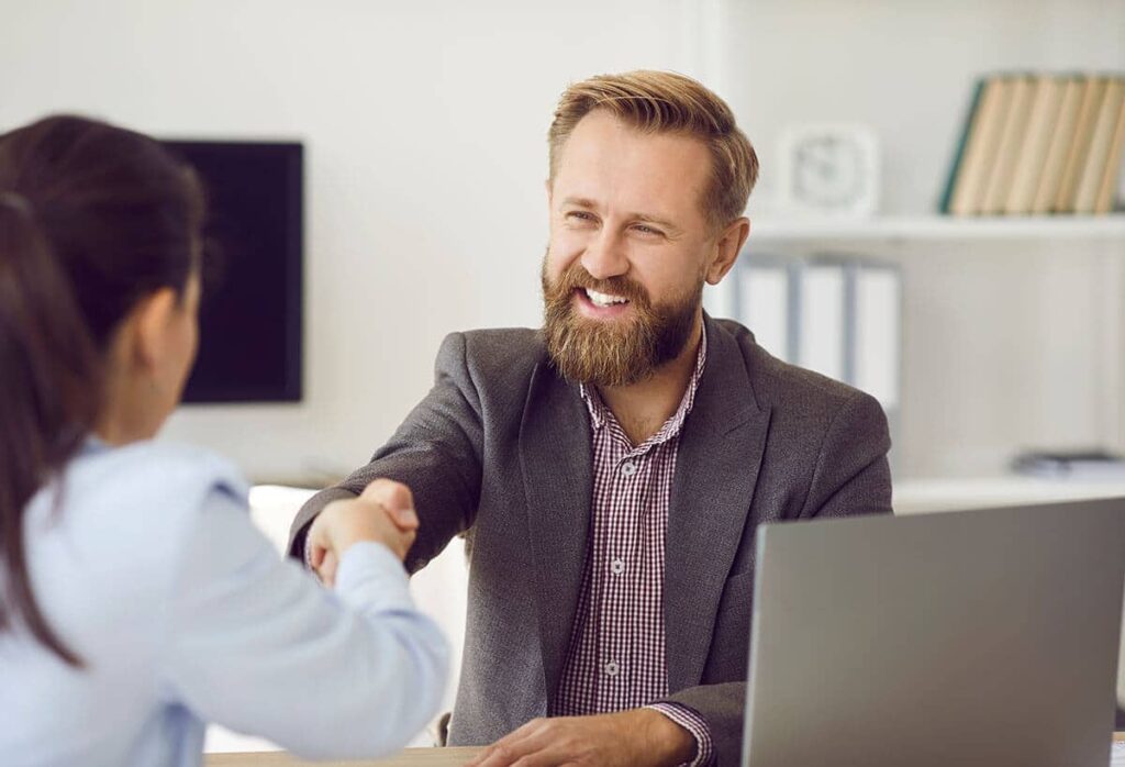 Shaking hands with new customer