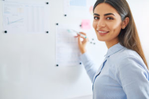 woman writing on board