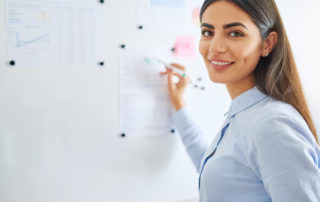woman writing on board