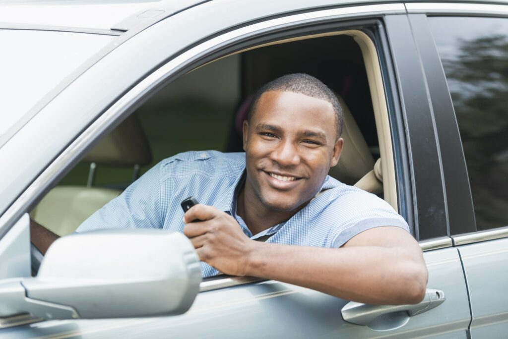 man with new car