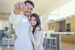 Couple holding a key in home loans options